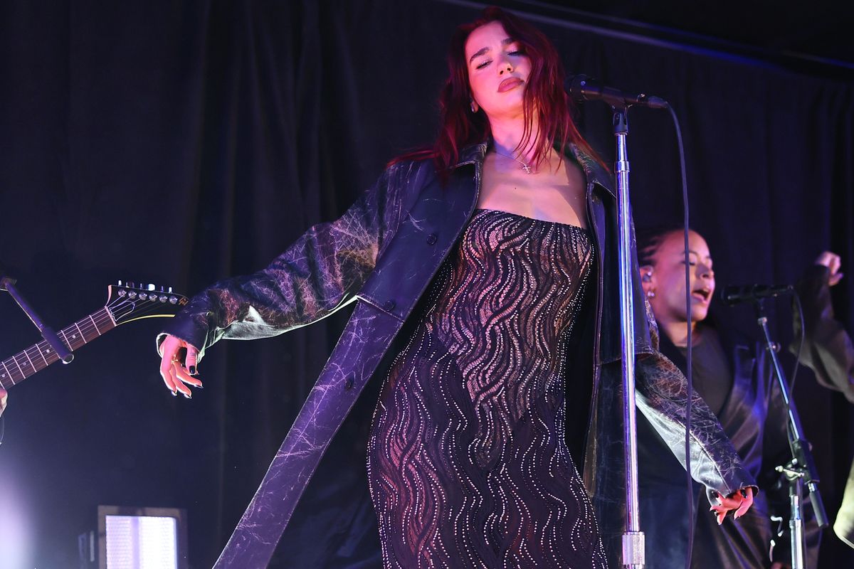 dua lipa wore a sheer bedazzled dress for a surprise performance in times square