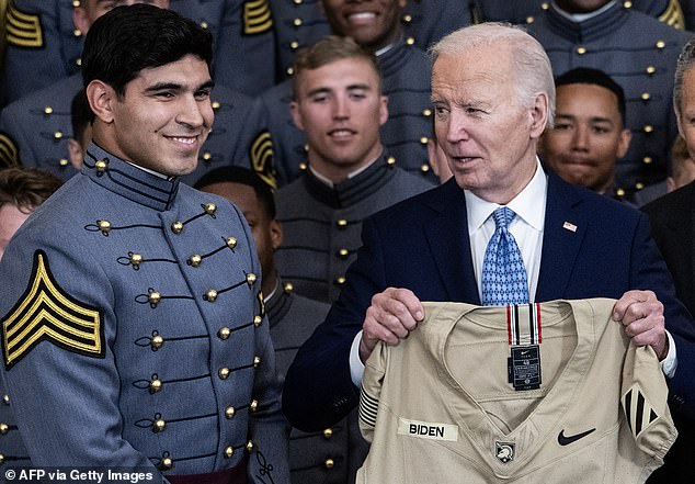 biden awards trophy to army and asks 'where are you, coach?'