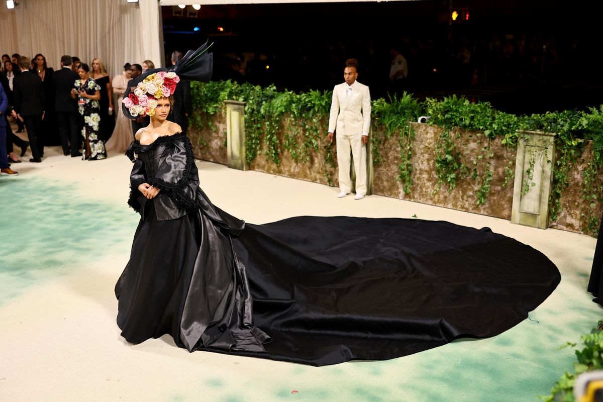 zendaya debuts second met gala look: a dramatic black gown and floral headpiece