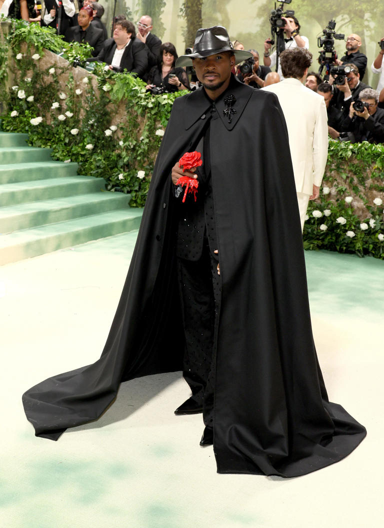 Usher looked like the caped crusader — or Tuxedo Mask from "Sailor Moon" — in custom Alexander McQueen.