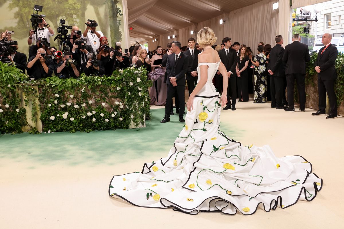 gigi hadid goes retro in a floral white tiered dress at the 2024 met gala