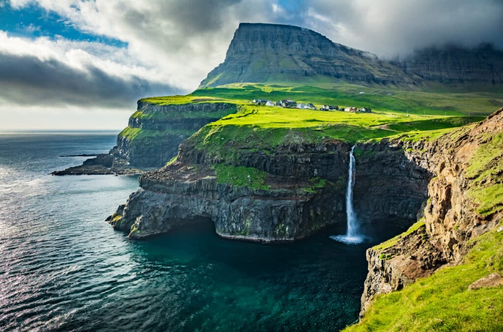 <p><span>Located between Iceland and Norway in the North Atlantic Ocean, the Faroe Islands are a collection of 18 volcanic islands characterized by dramatic cliffs, rugged coastlines, and long summer days. The islands offer picturesque villages, sheep-laden hillsides, and a great opportunity to disconnect from the modern world.</span></p>