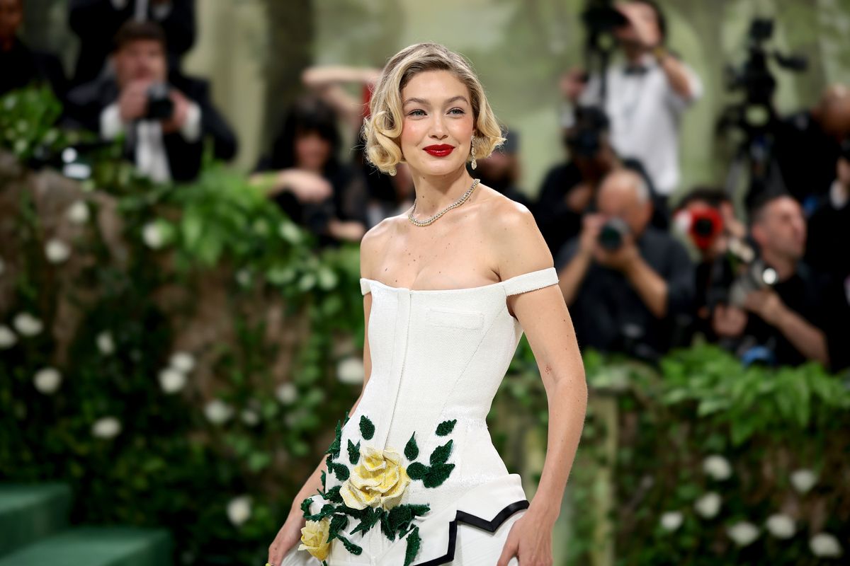 gigi hadid goes retro in a floral white tiered dress at the 2024 met gala