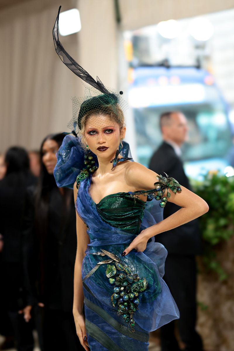zendaya debuts second met gala look: a dramatic black gown and floral headpiece