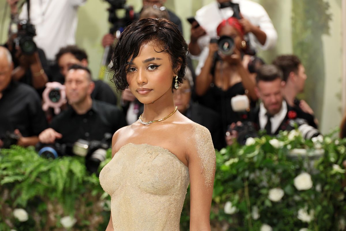 tyla shimmers in a gold-dusted gown at the 2024 met gala