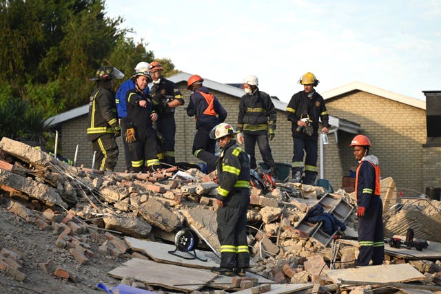 rescuers bring survivors from the rubble after building collapse in south africa