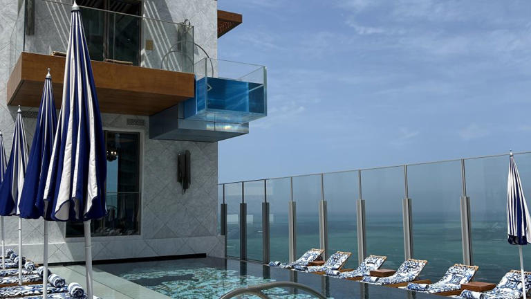 The VVIP Cabana on the Cloud 22 pooldeck overlooks the Arabian Gulf, with a glass plunge pool suspended from the second floor. - Rebecca Cairns / CNN