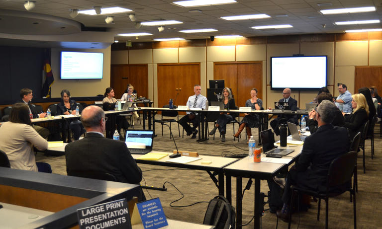 The Poudre School District Board of Education listens to a presentation on the Facilities Planning Steering Committee's draft scenarios for school consolidations, closures and boundary changes during a meeting in March in Fort Collins.