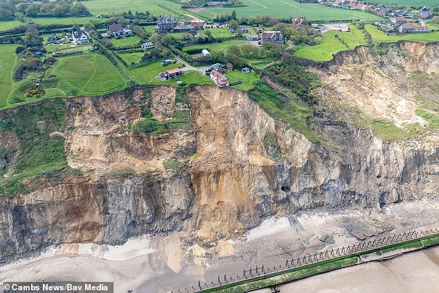 drone footage shows norfolk home close to collapsing as cliff crumbles