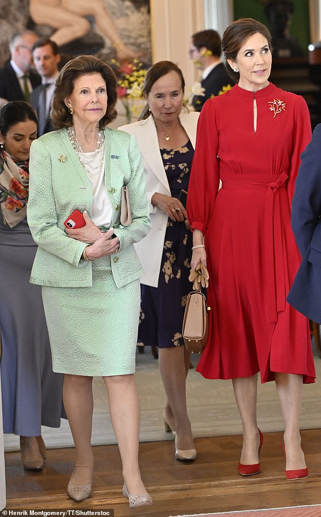 queen mary looks elegant as she is greeted by queen silvia in sweden