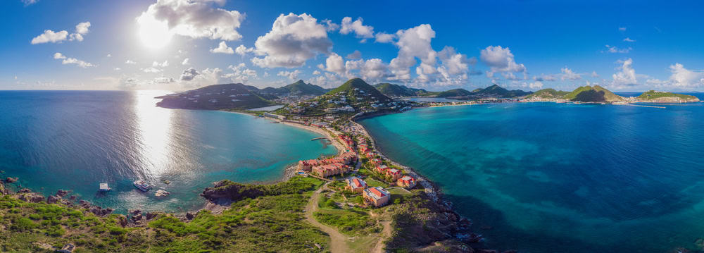 <p>St. Martin/St. Maarten is a unique dual-nation island with Dutch and French influences, offering a diverse range of experiences with estimated expenses ranging from $200 to $400+ per day per person. Philipsburg, on the Dutch side, is a shopper’s paradise with duty-free stores, while Marigot on the French side showcases chic boutiques and gourmet restaurants. Orient Bay is a popular beach destination known for its clothing-optional section and water sports activities. The island’s fusion cuisine reflects its cultural diversity, blending Caribbean flavors with European influences.</p>