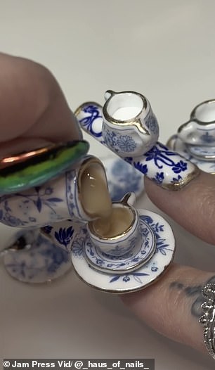 nail technician, 24, makes a cup of tea using only her acrylics