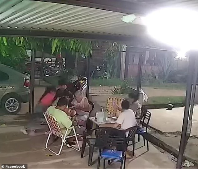 family narrowly avoids being struck by lightening as they drank tea