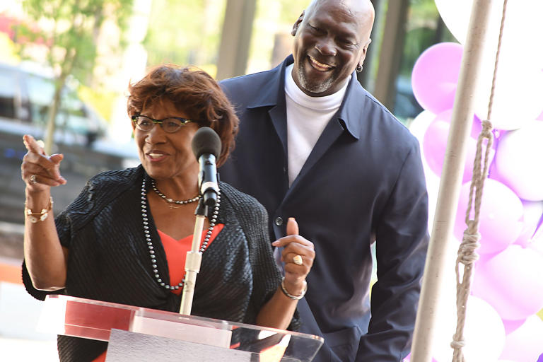 Michael Jordan and his mother Deloris Jordan talk to the crowd outside of The Michael Jordan Family Medical Clinic led by Novant Health. Both were taking part in a ribbon cutting ceremony for the new clinic opening off of Greenfield Street Tuesday May 7, 2024 in Wilmington, N.C. KEN BLEVINS/STARNEWS