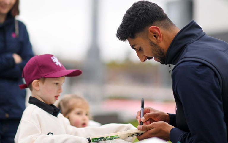 Shoaib Bashir signs autographs for Somerset fans but is not playing - Getty Images/Harry Trump