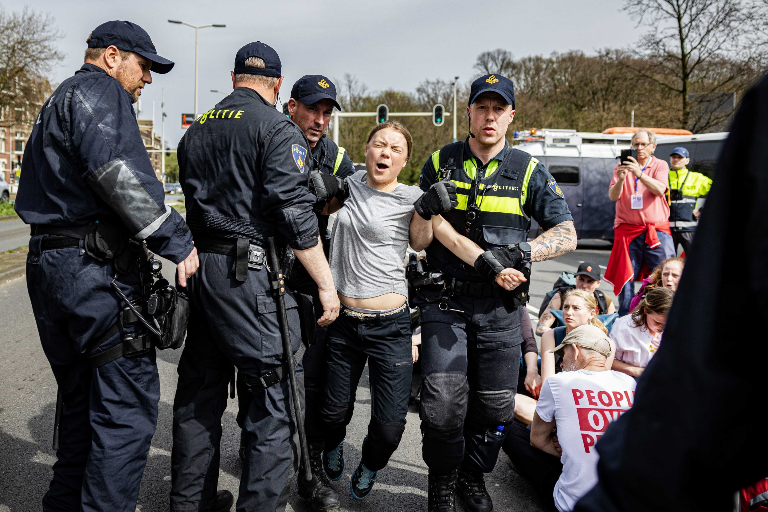 Greta Thunberg dragged away from climate protest by police