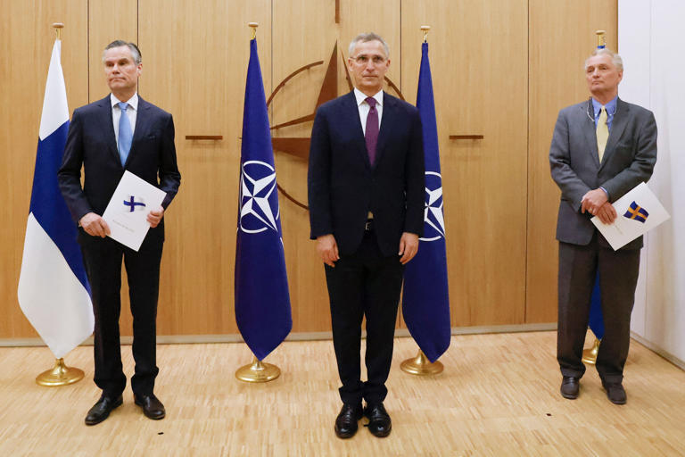 Above, Finland's Ambassador to NATO Klaus Korhonen, NATO Secretary-General Jens Stoltenberg, and Sweden's Ambassador to NATO Axel Wernhoff on May 18, 2022, in Brussels. Russia warned Finland about the consequences of NATO nukes being placed in its territory.