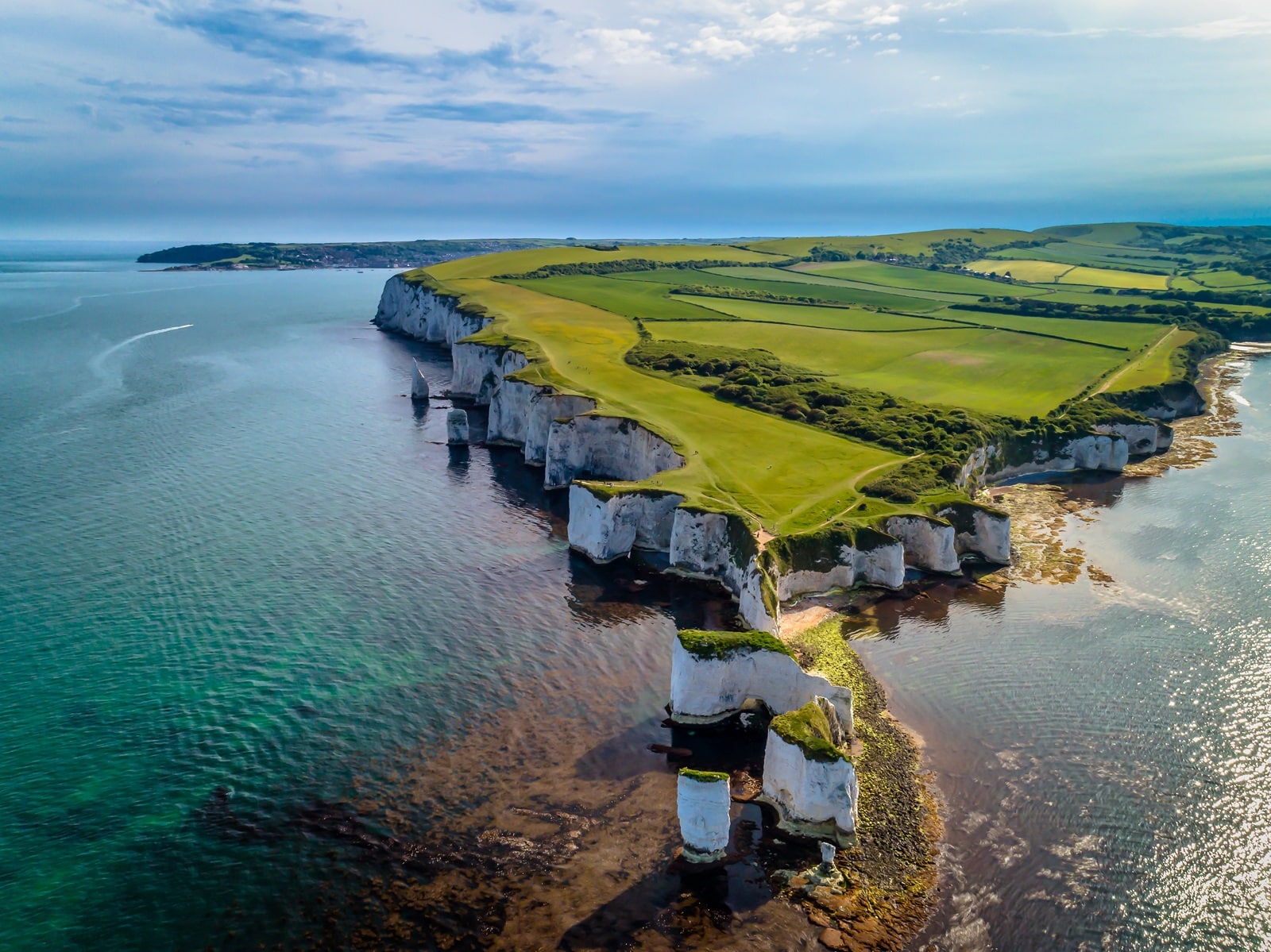 Image Credit: Shutterstock / Andy Lyons <p>Dorset’s dramatic coastline and rural retreats serve as a haven from the hustle and bustle, where safety is as solid as the Jurassic Coast’s cliffs.</p>