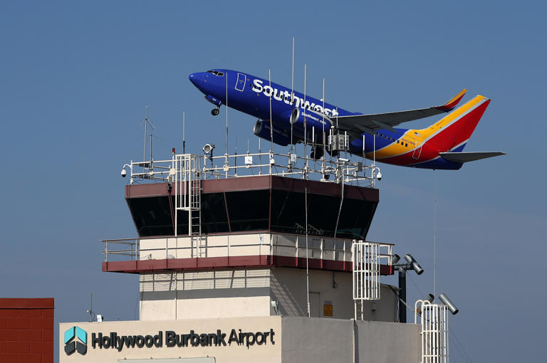 BURBANK, CALIFORNIA - SEPTEMBER 25: A Southwest Airlines take off past the control tower at Burbank Hollywood Airport on September 25, 2023 in Burbank, California. Transportation Secretary Pete Buttigieg is warning that vital training for new air traffic controllers would be paused if the government shuts down later this week. The Department of Transportation currently has 2,600 much needed air traffic controllers undergoing training and employs 1,200 fewer certified controllers than that agency did 10 years ago. (Photo by Justin Sullivan/Getty Images)