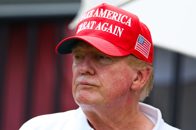 Donald Trump looks on at the first tee during day three of the LIV Golf Invitational - Miami at Trump National Doral Miami on April 07, 2024 in Doral, Florida. An organisation that has limits on its political activities held a fundraiser last week that may have benefited Trump.