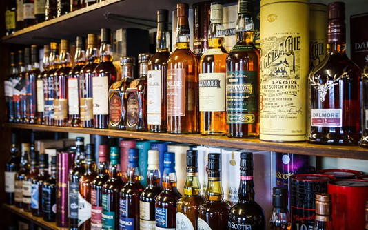 Various bottles of Scotch whisky on the shelf on May 16, 2015 in Tomintoul, UK.