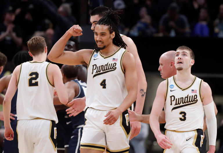 Purdue Boilermakers forward Trey Kaufman-Renn (4) reacts after scoring during NCAA Menâ€™s Basketball Tournament game against the Utah State Aggies, Sunday, March 24, 2024, at Gainbridge Fieldhouse in Indianapolis.