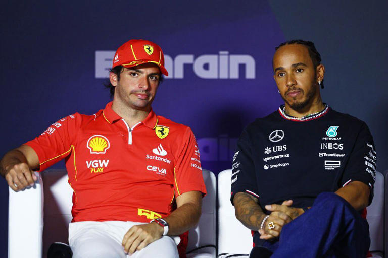 BAHRAIN, BAHRAIN - FEBRUARY 28: Carlos Sainz of Spain and Ferrari and Lewis Hamilton of Great Britain and Mercedes attend the Drivers Press Conference during previews ahead of the F1 Grand Prix of Bahrain at Bahrain International Circuit on February 28, 2024 in Bahrain, Bahrain. (Photo by Clive Rose/Getty Images)