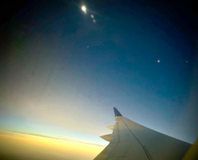 The eclipse in totality as Delta Air Lines flight 1218 from Austin, Texas to Detroit flies over Poplar Bluff, Missouri on Monday, April 8, 2024.