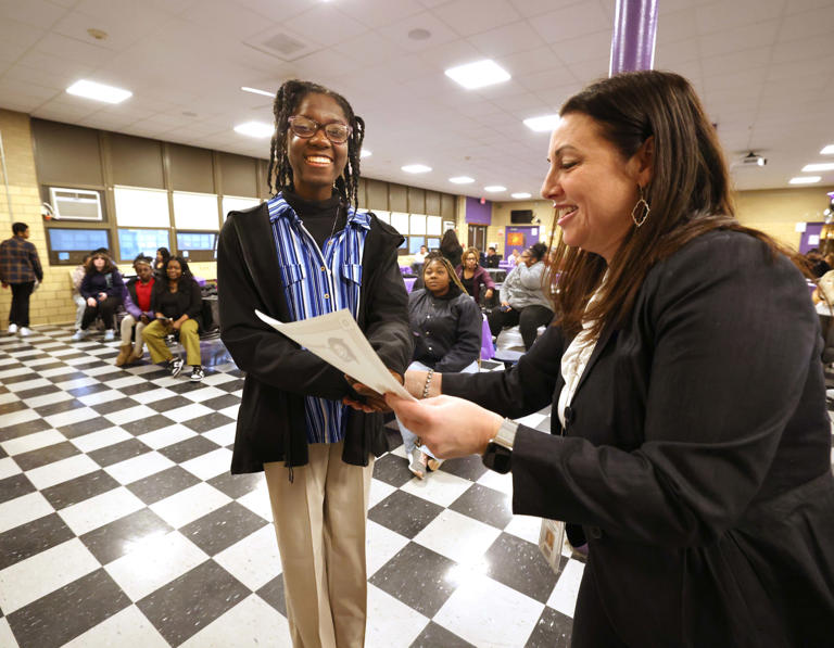 North Middle School 500 Club's Skhaell Guiteaud receives her certificate from Principal Alison Ramsay during a celebration Tuesday, April 2, 2024 for seventh and eighth grade students who achieved a score of 500 or more on their MCAS math and English tests.