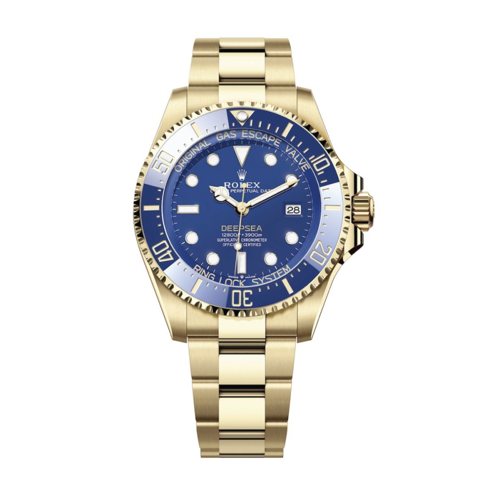 <p>It’s the first ever Oyster Perpetual Rolex Deepsea to be presented in 18 ct yellow gold. It’s also the first time the Deepsea has worn a Cerachrom bezel, <em>and</em> this is the first time that Rolex has separated the Deepsea from the Sea-Dweller lineup. That’s a lot of firsts.</p> <p>That gold’s striking juxtaposition to the rich blue of the lacquer dial and ceramic bezel is not being lost on the crowds mingling in the Geneva Palexpo convention center at the time of writing. But serious dive watch geeks right now are busy marveling at a new technical masterstroke: the compression ring within the Ringlock system in this new piece – the part of the watch’s architecture that equips it to withstand depths of up to 3,900 meters – is now crafted from ceramic.</p> <p>Technical diving innovation is an ongoing mission for Rolex, and the Deepsea has always been renown for its compression resistance. The Crown isn’t quoting any new depth figures, however — which is fine, because the 3,900 meters on offer since the Deepsea’s launch in 2008 imposes roughly 65 times the pressure the human body can endure. Ceramic also offers anti-deformation properties, though, and there’s no doubt that this piece’s waterproofness will be more robust than previous models, to be tested only should you drop it overboard in the middle of the ocean.</p> <p>Tool watches being fit for purpose whatever they’ll end up (not) being used for is one of the industry’s core underlying tenets: and, as well as offering a strikingly aquatic vibe, the deep blue dial admirably complements legibility features such as the Chromalight display, the contrasting shapes of the hour markers, and differentiated hands which, like the triangular ‘zero’ marker on the bezel, are also filled with Chromalite, Rolex’s proprietary luminescent material.</p> <p><strong>Case Size:</strong> 44 mm <br> <strong>Movement:</strong> Calibre 3235<br> <strong>Power Reserve:</strong> 70 Hours<br> Movement: caliber 3235 auto-winding mechanical with date<br> <strong>Price:</strong> $52,100</p>