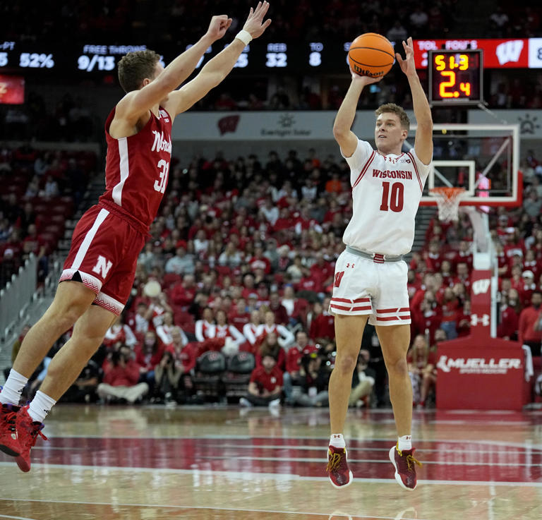 Wisconsin guard Isaac Lindsey (10) shoots over Nebraska guard Cale Jacobsen (31) during the second half of their game Saturday, January 6, 2024 at the Kohl Center in Madison, Wisconsin. Wisconsin beat Nebraska 88-72.
