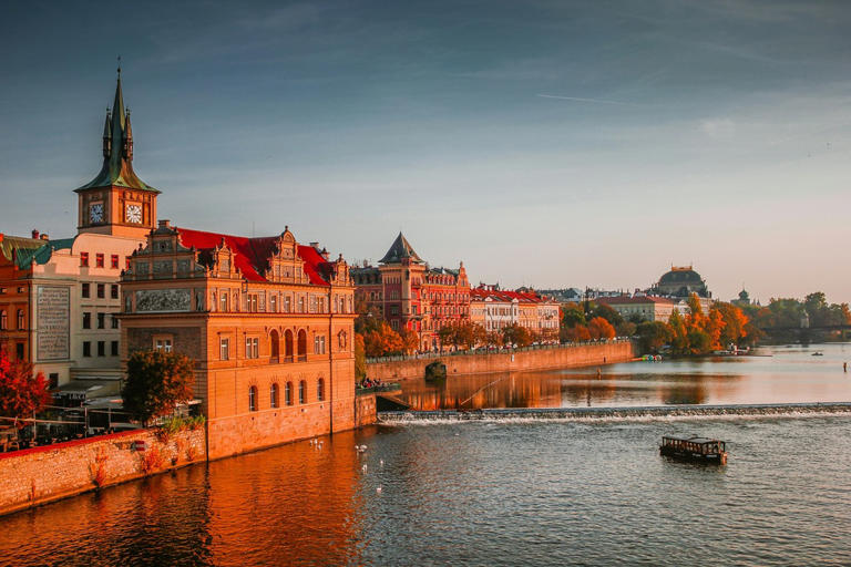 Learn more about the safety level and affordability of Czechia. pictured: a view of Prague in the Czech Republic near the Charles Bridge during sunset