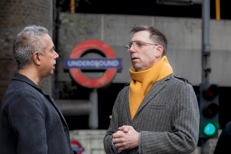 Rob Blackie speaks to resident at tube stop.jpg