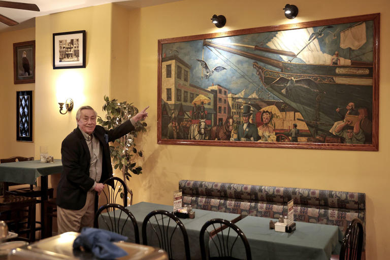 Bonner's Irish Pub owner Danny Bonner talks about a 1960 painting of the pub that hangs in a dining room where President Jimmy Carter once ate lunch.
