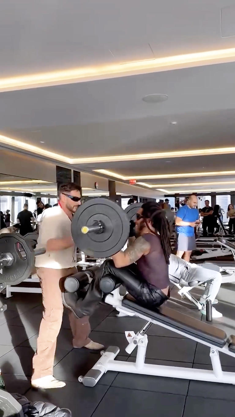 Lenny Kravitz lifts weights in leather pants and sheer tank top ...