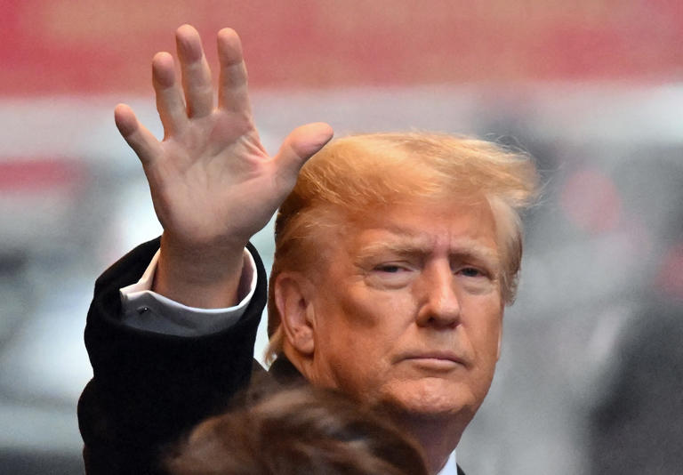 Donald Trump waves as he departs for the E. Jean Carroll sexual assault defamation trial in New York on January 25, 2024. Trump is now suing ABC News for its coverage of the Carroll case. (Photo by ANGELA WEISS / AFP) (Photo by ANGELA WEISS/AFP via Getty Images)
