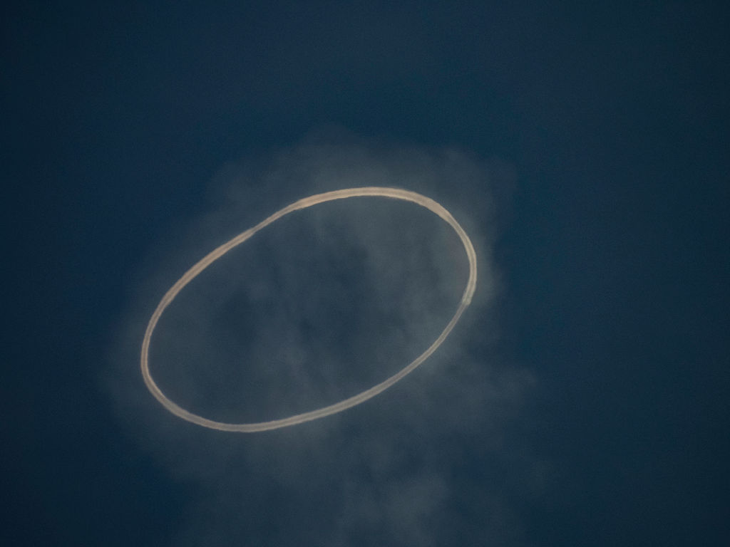 <p>A steam ring called a volcanic vortex ring is generated by the southeast crater of Mt. Etna in Catania, Italy, on April 6, 2024.</p>