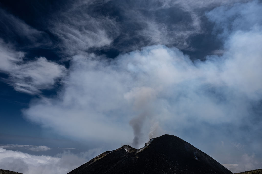 <p>Mt. Etna's southeast crater emits gas in Catania, Italy, on Aug. 9, 2023.</p>