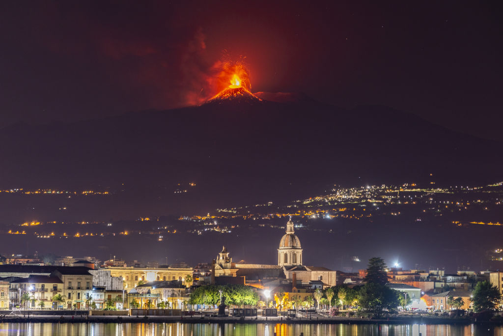 <p>A photo taken from Riposto, Italy, shows an eruption at Mt. Etna in Catania, Italy, on July 7, 2021. The Southeast crater erupted a little more than 48 hours after the last volcanic event there, with the highest jets of the lava fountain reaching 1,000 meters. </p><p>The eruptive column was carried by the wind to the south, and the heavy rain of ash fell on the city of Catania. It was the 46th eruptive episode in 2021, marking the largest series of eruptions in a short period of time in 20 years. </p>