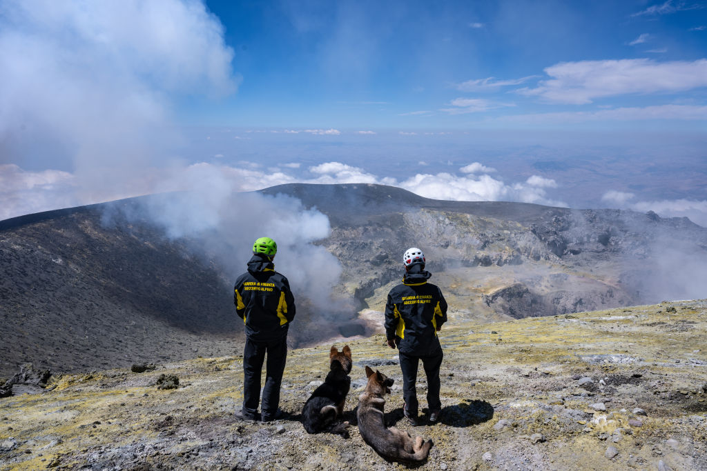 <p>Mt. Etna's volcanic activity is seen during a training session of the SAGF, the mountain rescue team of the Italian Guardia di Finanza, which operates on the highest active volcano on the Eurasian plate in Catania, Italy, on Aug. 9, 2023.</p>