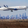 Delta plane returns to airport after emergency slide 