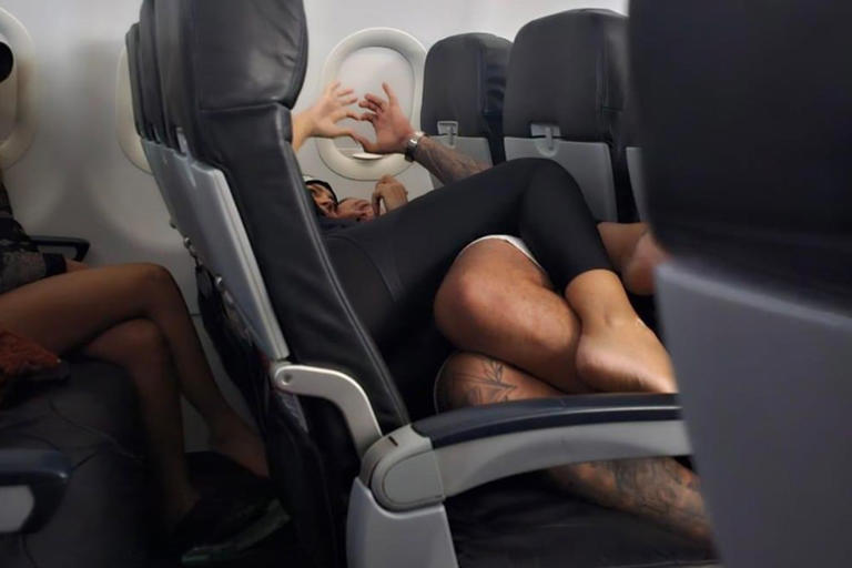 Passenger Horrified By Barefoot Flyers Snuggling On Top Of Each Other