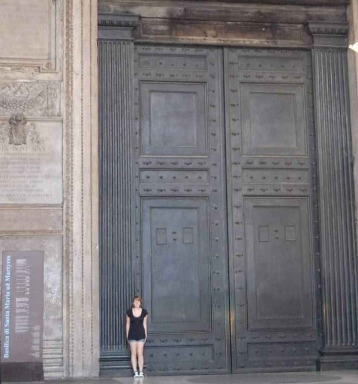 <p>This is the oldest door that is still in use in Rome, and it's freakin' HUGE. The picture doesn't even do it justice, but it's a whopping 25 feet high. </p> <p>Humans are so small, but we seem to believe that we need huge doors? Where is the logic, people? </p>