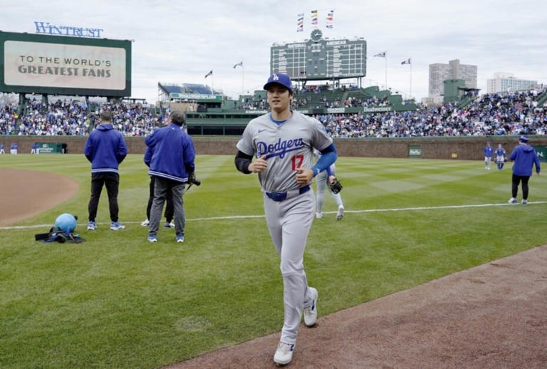 Apr 7, 2024; Chicago, Illinois, USA; Los Angeles Dodgers designated hitter Shohei Ohtani (17) warms up before the game against the Chicago Cubs at Wrigley Field. Mandatory Credit: David Banks-USA TODAY Sports