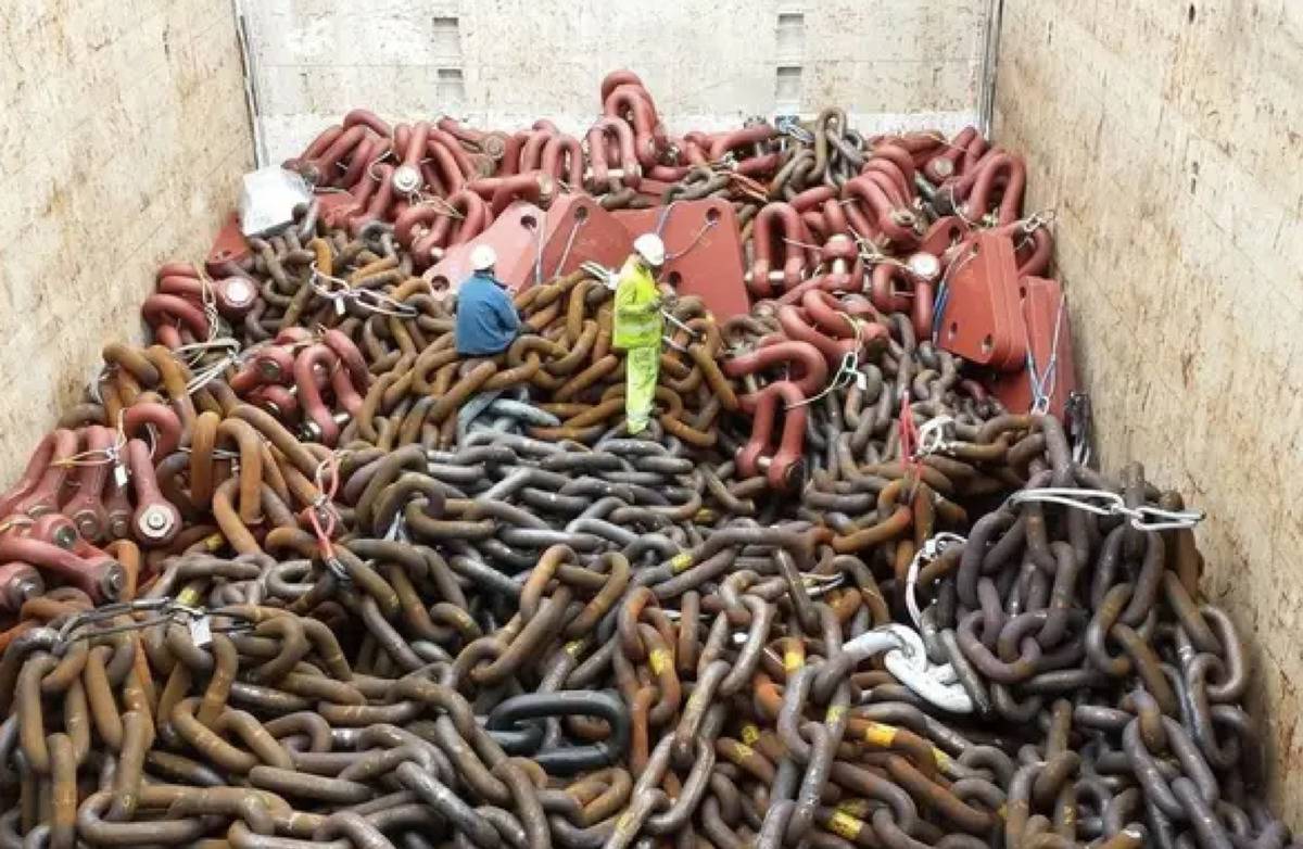 <p>Behold, some really, really large anchor chains for an offshore platform. Look at how small these people look amongst what looks like a literal <i>sea of chains. </i></p> <p>I'm not sure what they're doing with it, but I'm going to assume that it's going in the water at some point. </p>