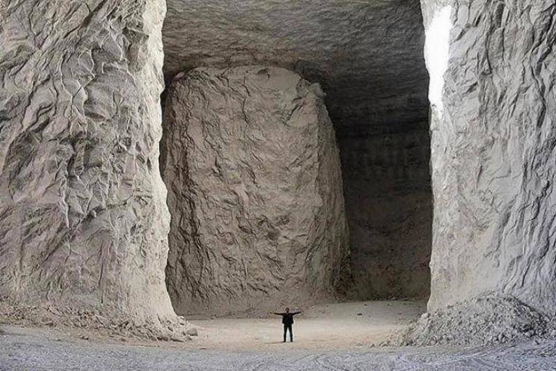 <p>These are the salt mines of Garmsar, located in Iran. </p> <p>That human standing in the middle provides the perfect context, as you see how tall and wide it is in there.</p>