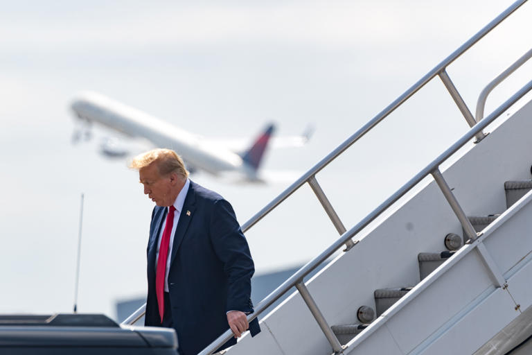 Former U.S. President Donald Trump arrives at the Atlanta Airport on April 10, 2024 in Atlanta, Georgia. On April 10, 2024, Trump shared a post on TruthSocial, showing evidence he said he "just found" in the Stormy Daniels case.