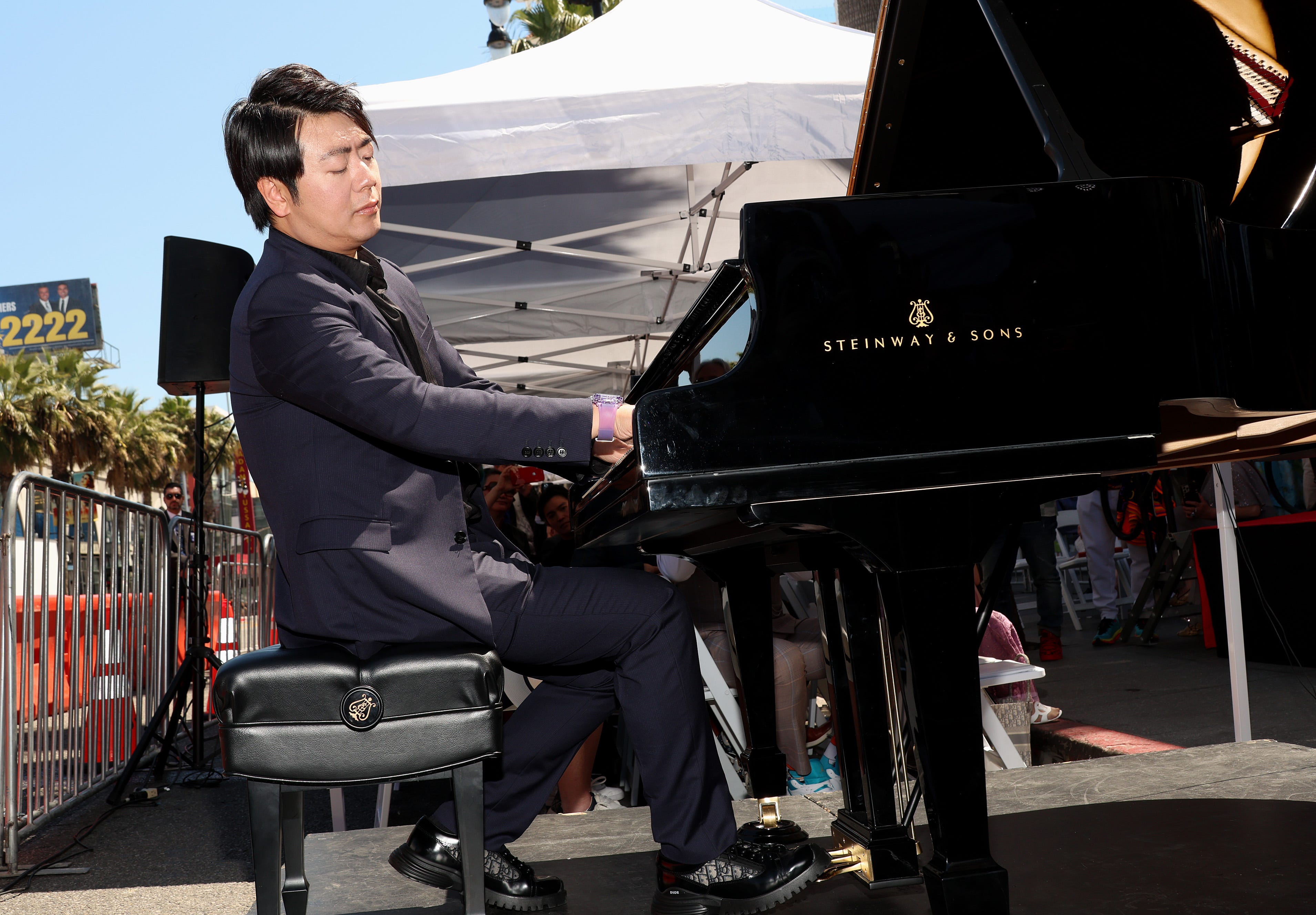 Lang Lang tickles the ivories for a performance during his Walk of Fame ceremony.