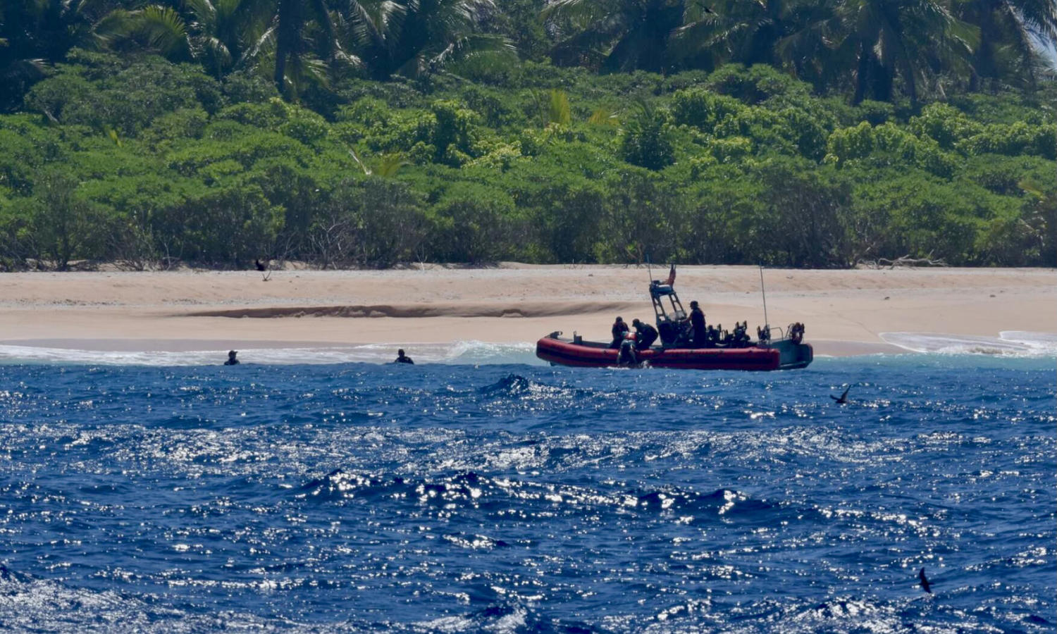 stranded sailors rescued from tiny pacific island after making 'help' sign with leaves