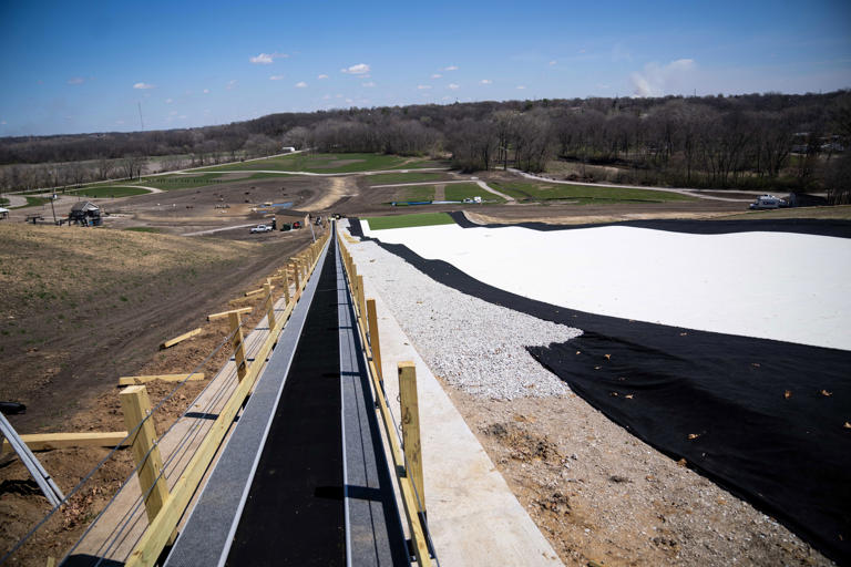 The view from the top of a nearly 600-foot synthetic ski hill sits under construction by the Polk County Conservation Board Tuesday, April 8, 2024, at the Sleepy Hollow Sports Park in Des Moines. The park is slated for a May 25th opening.